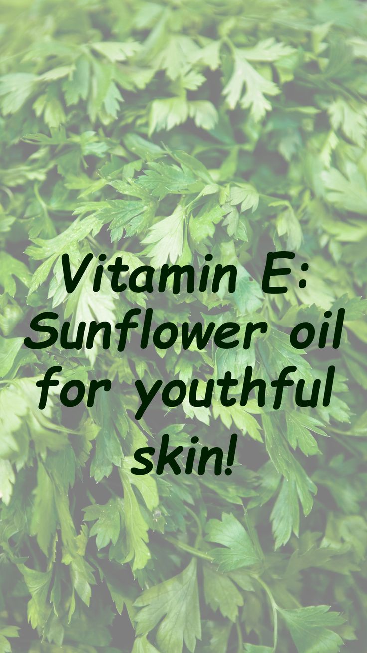 green leaves with the words vitamin e sunflower oil for youthful skin on top of it