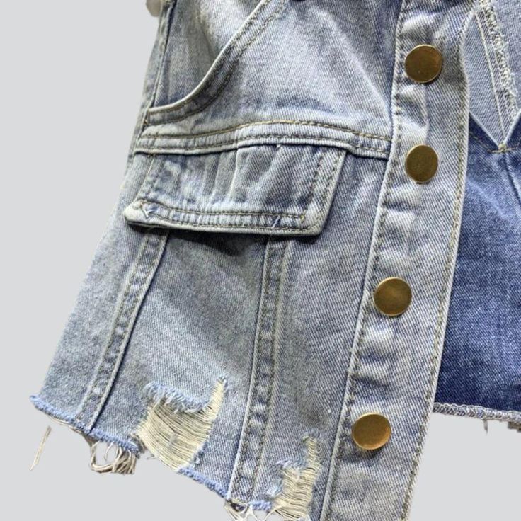 Introducing the 2023 Summer Collection's distressed hem buttoned denim skort. a grunge-inspired masterpiece perfect for the modern fashionista!Why You'll Fall In LoveThis skort is a unique combination of vintage-inspired grunge and urban flair. tailored to fit comfortably and stylishly. Its mid-waist rise. distressed hem. and buttoned closure all come together to create a timeless look that will take you from day to night with ease.Unmissable Highlights: Grunge-Inspired: Tap into the grungy vibe Trendy Summer Denim Jacket With Frayed Hem, Fall Denim Cutoff Jean Shorts, Medium Wash Denim Jean Shorts For Fall, Fall Medium Wash Denim Jean Shorts, Frayed Hem Denim Jean Shorts For Fall, Medium Wash Jean Shorts With Button Closure For Spring, Denim Jean Shorts With Frayed Hem For Fall, Summer Denim Jacket With Frayed Hem And Button-up, Trendy Washed Denim Blue Jean Shorts