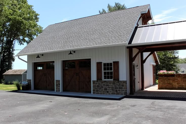 two garages are shown in the middle of a parking lot