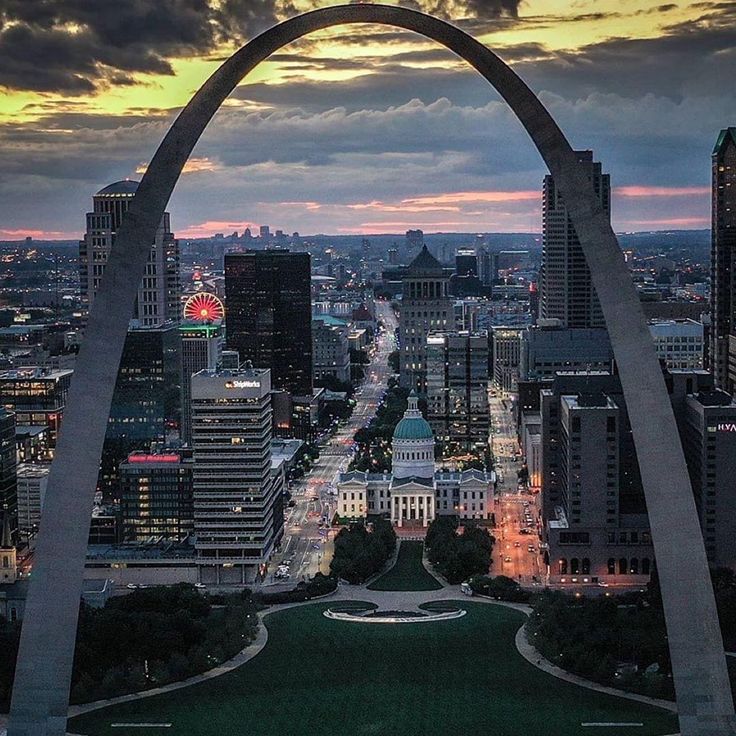 an aerial view of the st louis arch at dusk, taken from the top of the saint louis arch