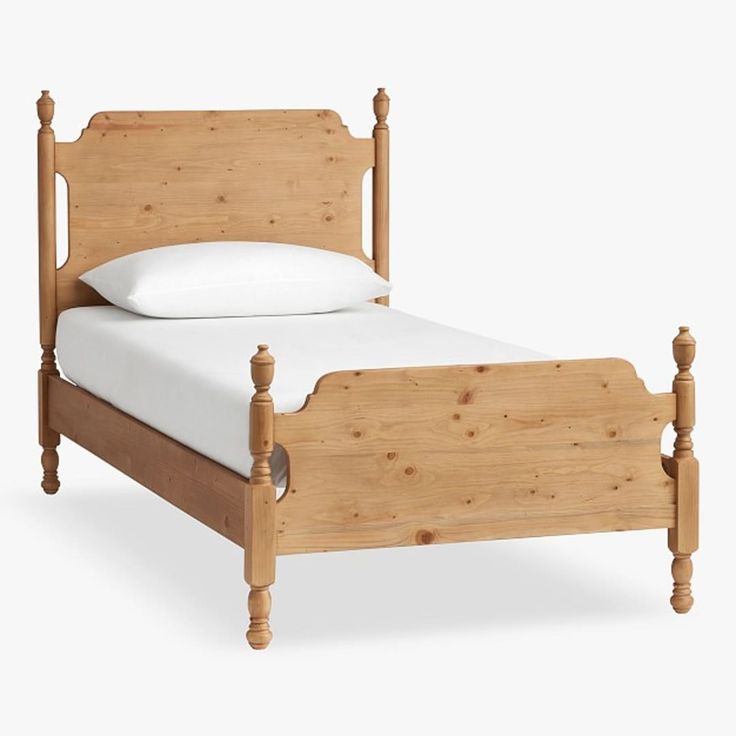 a wooden bed with white sheets and pillows on it's headboard, against a white background