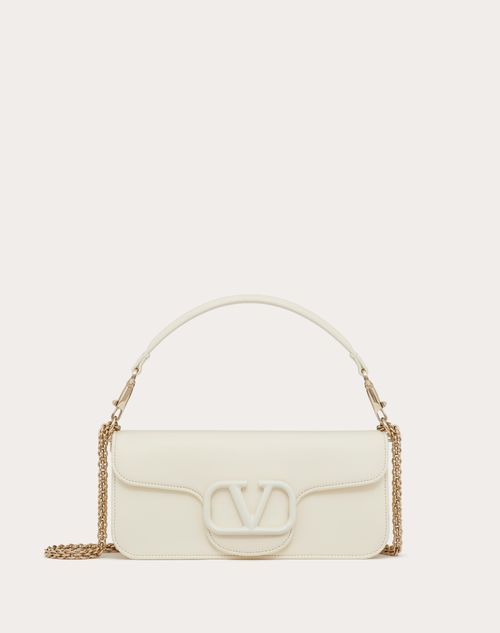 Valentino Garavani Locò shoulder bag in calfskin leather with enamel tone-on-tone VLogo Signature detail. Equipped with both a detachable sliding chain strap and a detachable handle, this accessory can be worn as a crossbody/shoulder bag or carried as a handbag. - Platinum-finish hardware - Magnetic closure with logo - Removable leather handle - Shoulder strap with removable sliding chain - Nappa leather lining. Interior: one slip pocket Shoulder strap drop length: min. 26 cm / 10.2 in. to max. Bag For Women, Nappa Leather, Magnetic Closure, Leather Handle, Fashion Handbags, Crossbody Shoulder Bag, Chain Strap, Valentino Garavani, Shoulder Bag Women