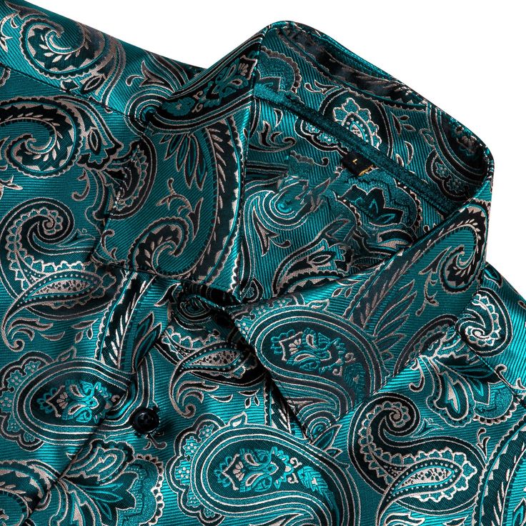 This is the perfect shirt for any man who wants to look stylish and sophisticated. The paisley print is elegant and timeless, and the shirt fits comfortably and looks great on anyone. Whether you're dressing up for a special event or just want to feel your best, this is the shirt for you. Handmade 100% Silk Paisley Dry Clean Only - 30-DAY MONEY-BACK GUARANTEE - Try it! If you don't love it, send it back. We offer free shipping on returns and exchanges. Take your time! You've got 30 days to decid Classic Paisley Print Button-up Shirt, Elegant Paisley Print Button-up Tops, Formal Long Sleeve Paisley Print Shirt, Classic Patterned Top For Formal Occasions, Elegant Patterned Formal Shirt, Elegant Formal Patterned Shirt, Classic Patterned Formal Shirt, Patterned Button-up Formal Shirt, Formal Patterned Button-up Shirt