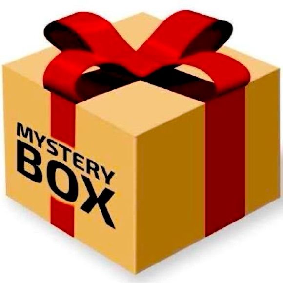 a box with a red bow and the word mystery box on it's side