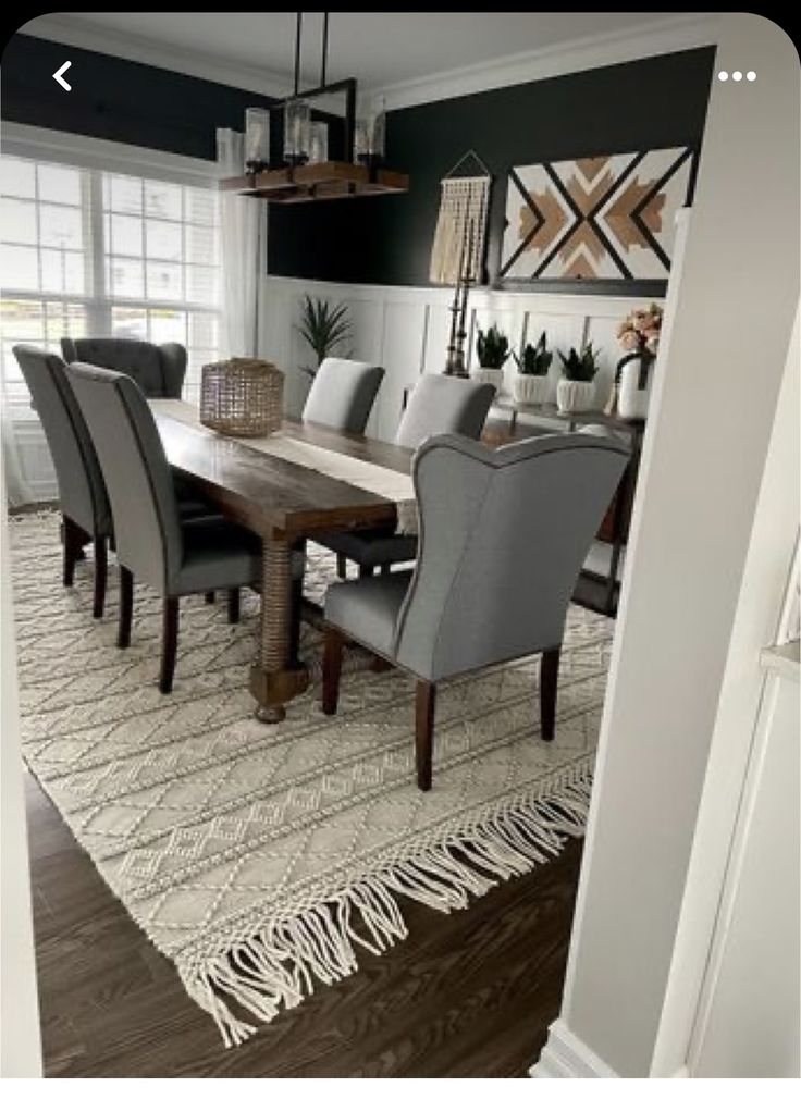 the dining room table is set with gray chairs