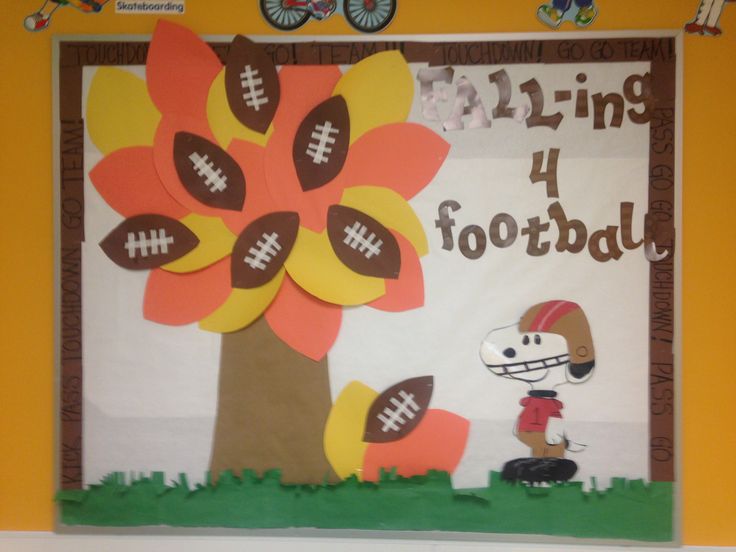 a football themed bulletin board with paper flowers and a tree on the side that says spring 4 football