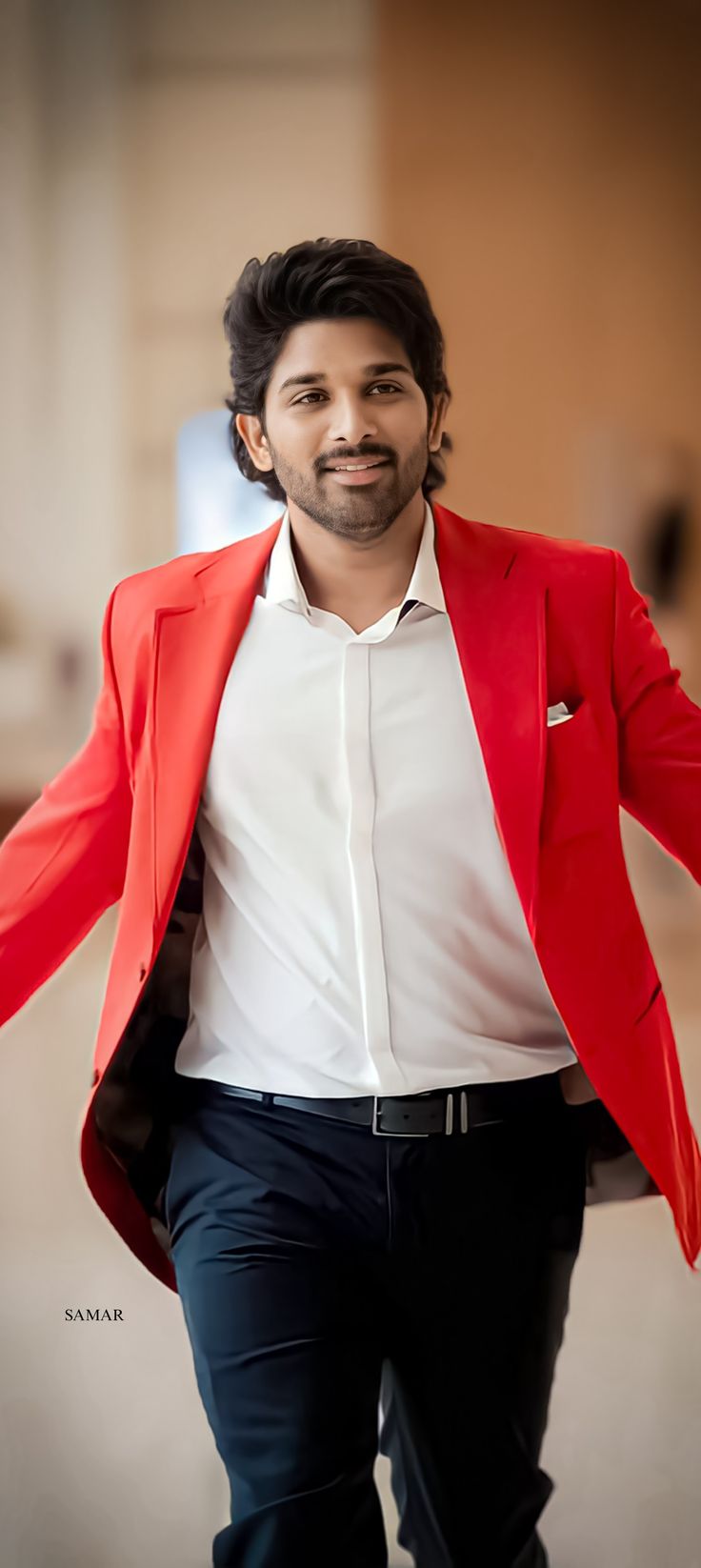 a man in a red blazer and white shirt is walking with his arms outstretched