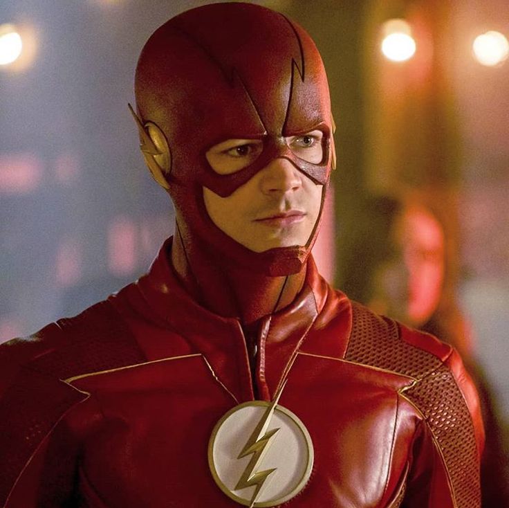 the flash standing in front of some lights