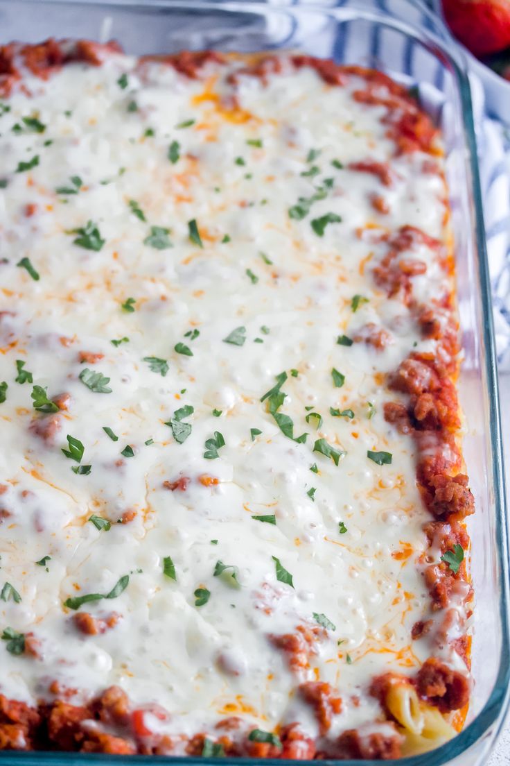 a casserole dish filled with meat and cheese