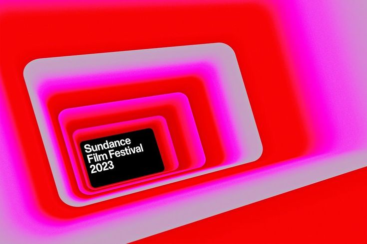 an abstract photo with pink and red colors in the center is a black sign that reads sundae festival 2013