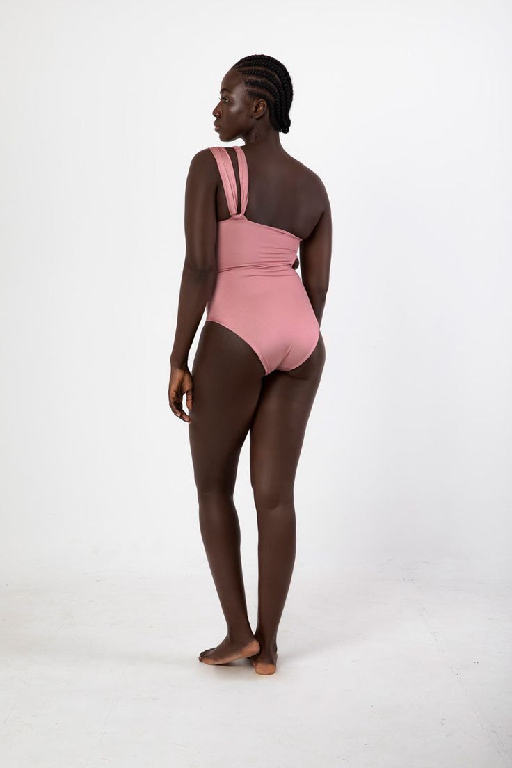 *FINAL SALE* The Alina One Piece in Shiva Pink by Maygel Coronel is a one-piece swimsuit featuring asymmetric ruching, bodice cutouts, and one-shoulder silhouette. Pair with skirts or trousers for a body suit. 78% Polyamide 22% Elastane Made in Columbia Body Suit, Thom Browne, Cut Outs, Victoria Beckham, Shiva, One Piece Swimsuit, Final Sale, Showroom, Columbia