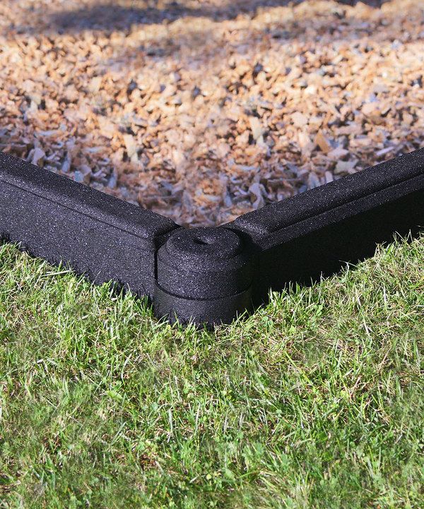 a black plastic box sitting on top of green grass