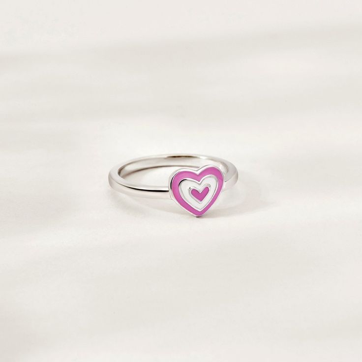 This groovy heart ring is such a sweet accessory for any child who loves fun and fashion. The cute pink and white enamel design adds a touch of playfulness, making it a favorite among young girls. Made from high-quality 925 sterling silver, it is both durable and hypoallergenic, ensuring that it is safe for even the most sensitive skin. The heart-shaped design is not only adorable but also a symbol of love and affection, making it a meaningful gift for any special occasion. This adorable ring is Groovy Heart, Sweet Accessories, Love Symbols, White Enamel, Cute Pink, Meaningful Gifts, Pink And White, Pink Girl, Sterling Silver Ring