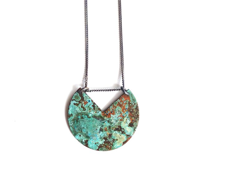 "Brass has been oxidized with our own unique patina process. This necklace is part of the El Mar Patina Collection which is inspired by the beautiful beaches of Mexico. Necklace hangs from oxidized sterling silver chain 16\"-18\". Measurement: 1.25\" Please not that the patina process is an organic process and shades of color will vary. All of our items are HANDMADE and made to order and may take up to approx. 2 weeks to fabricate (not including shipping time). During the holiday season fabricat Patina Round Pendant Necklaces For Gift, Round Pendant Necklace With Patina For Gift, Patina Round Pendant Necklace For Gift, Unique Green Patina Necklaces, Unique Patina Round Pendant Necklace, Green Artisan Necklace With Patina, Artisan Green Necklace With Patina, Unique Pendant Necklace With Patina, Turquoise Copper Necklace With Patina