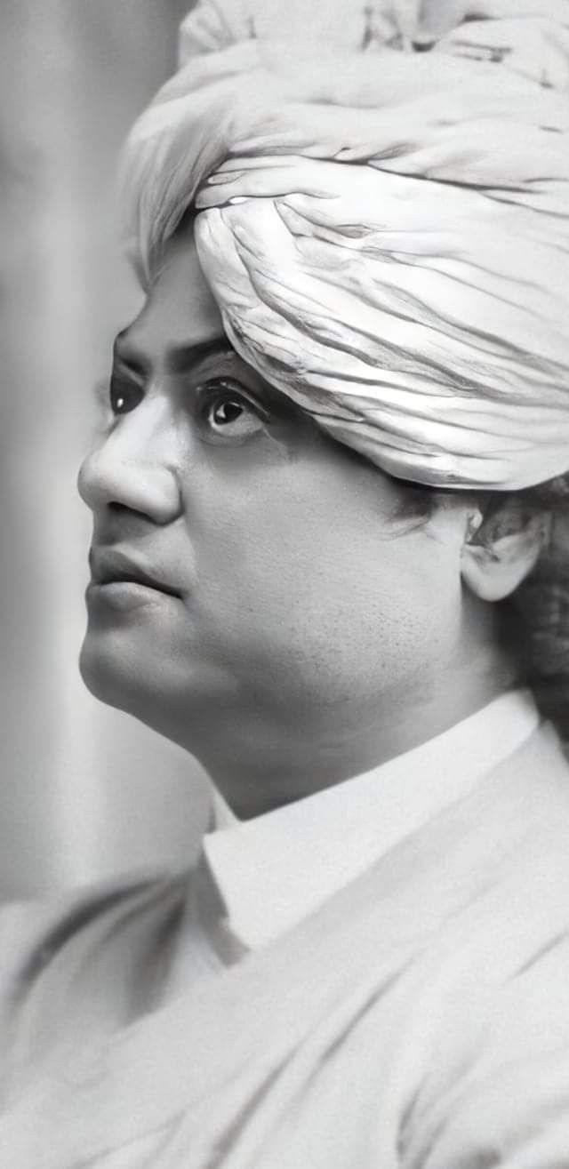 a black and white photo of a man wearing a turban