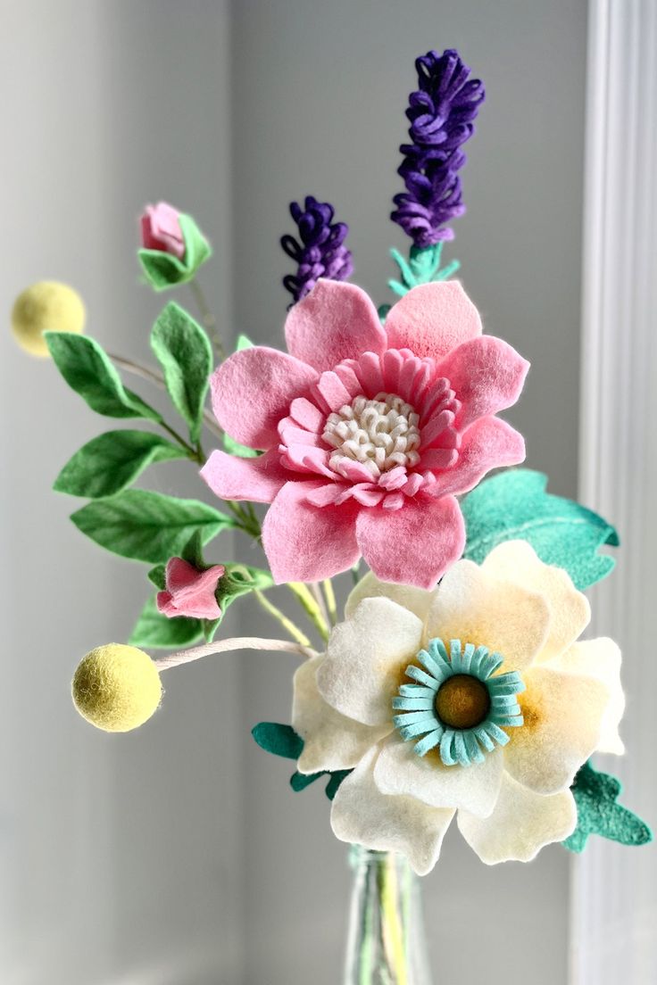 a vase filled with flowers on top of a table