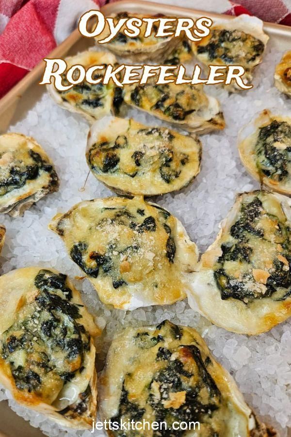 oysters with cheese and spinach on ice in a tray for dinner or appetizers