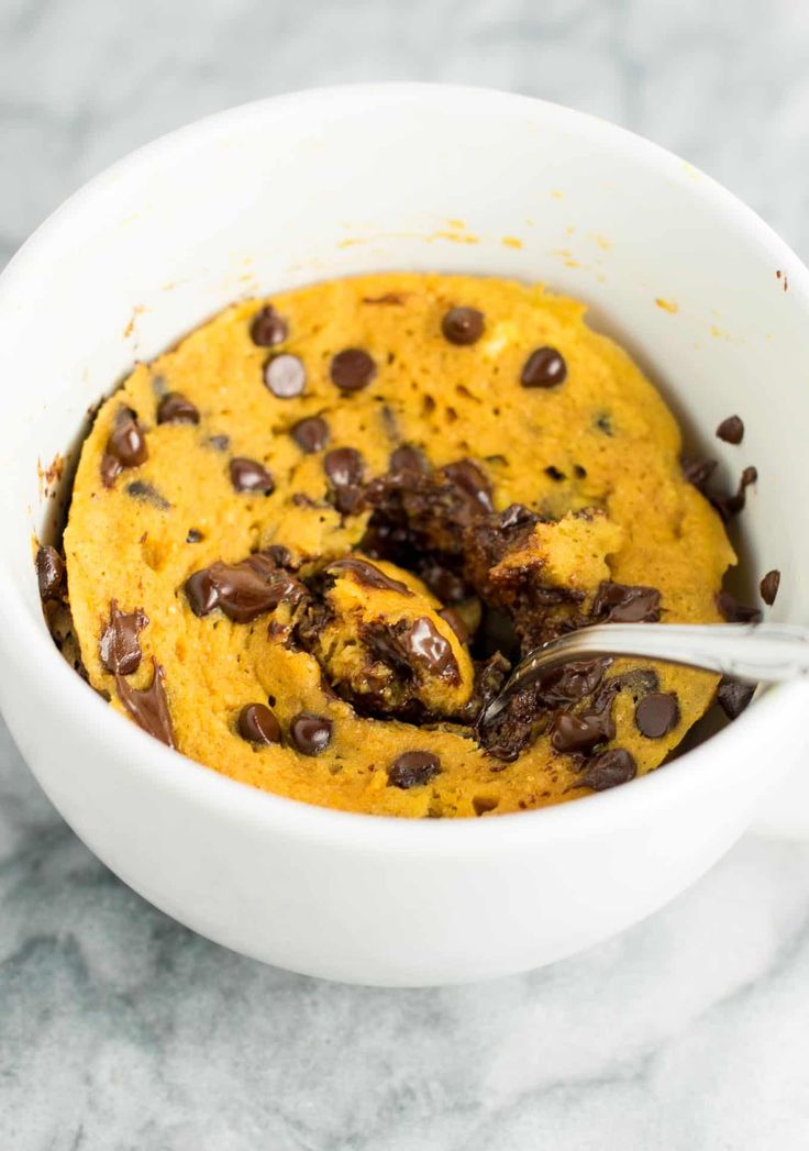 a white bowl filled with chocolate chip cookie dough