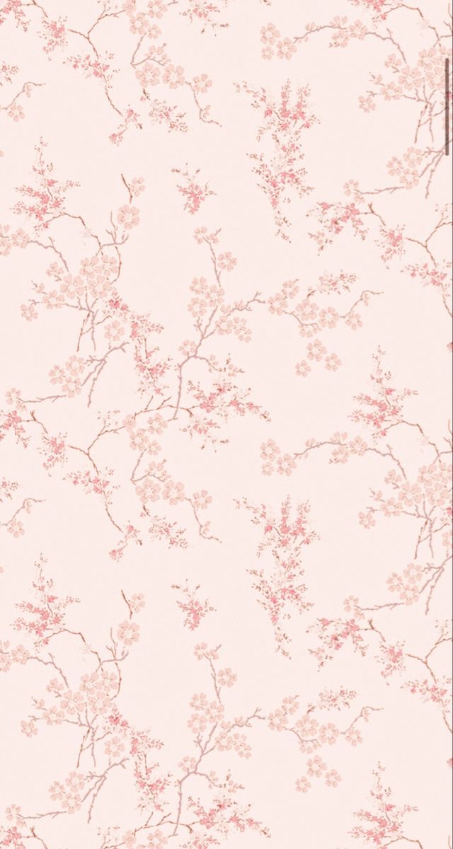 a wallpaper with pink flowers and branches in the background, on a white surface