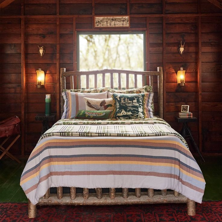 a bed in a room with wooden walls