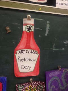 art class ketchup day sign on the chalkboard with magnets attached to it