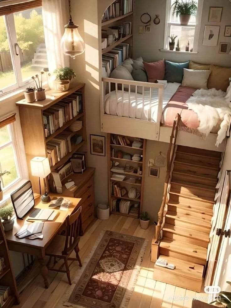 a loft bed with stairs leading up to the top floor and bookshelves on either side