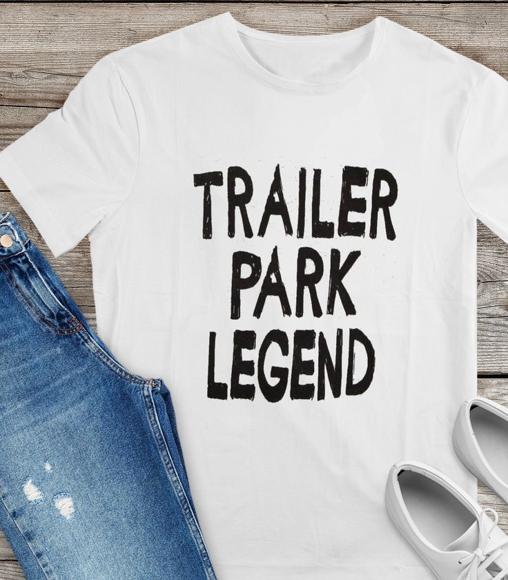 "Short sleeve, 100% cotton t-shirt with \"Trailer Park Legend\" printed on full front." Cotton T-shirt With Sublimation Print For Fans, Summer Band Merch T-shirt, Pre-shrunk, Summer Band Merch T-shirt Pre-shrunk, Summer Cotton T-shirt With Band Merch, Basic White Ring-spun Cotton T-shirt, White Basic Ring-spun Cotton T-shirt, Summer Band Merch Shirt With Letter Print, Band Merch Cotton Shirt For Summer, Summer Band Merch Cotton Shirt