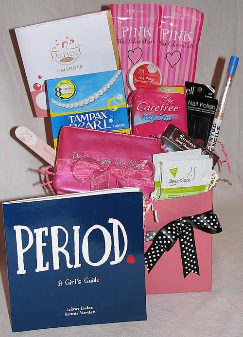 a pink gift box filled with lots of goodies