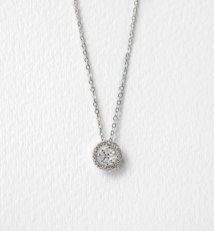 PRODUCT DETAILS: - White Gold over Sterling Silver - Cubic Zirconia Crystals (Best Quality!) - Hypoallergenic posts for sensitive ears - Pendant Diameter 3/8 in, Chain L 16 in + 2 in ext - Earrings 3/ Party Jewelry With Halo Setting In Diamond White, Diamond White Jewelry With Halo Setting For Party, Elegant Solitaire Necklace With Sparkling Stones For Anniversary, Cubic Zirconia Jewelry With Halo Setting For Party, Delicate Cubic Zirconia Jewelry With Halo Setting, Party Jewelry With Cubic Zirconia In Halo Setting, Elegant Solitaire Crystal Necklace With Round Pendant, Elegant Crystal Solitaire Necklace With Round Pendant, Elegant Crystal Pendant Solitaire Necklace