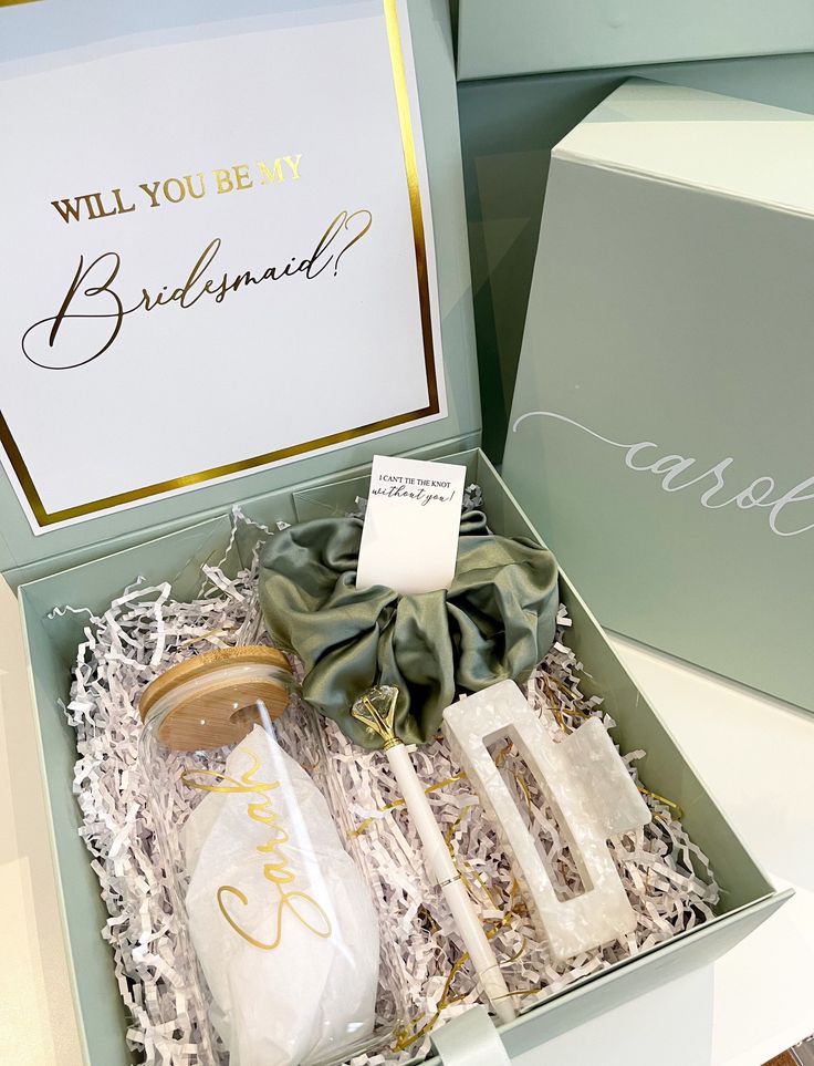 the bridesmaid gift box is open to reveal its contents