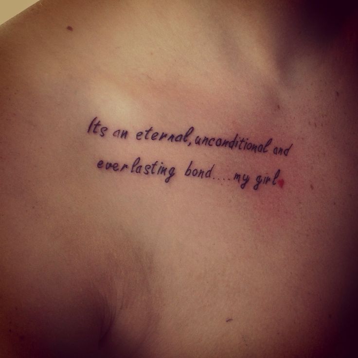 a chest with a tattoo saying life is an external, unconditional and everlasting bond my god