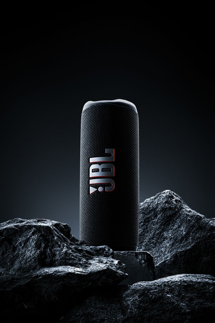 the jbl's new bluetooth speaker is shown on top of some rocks