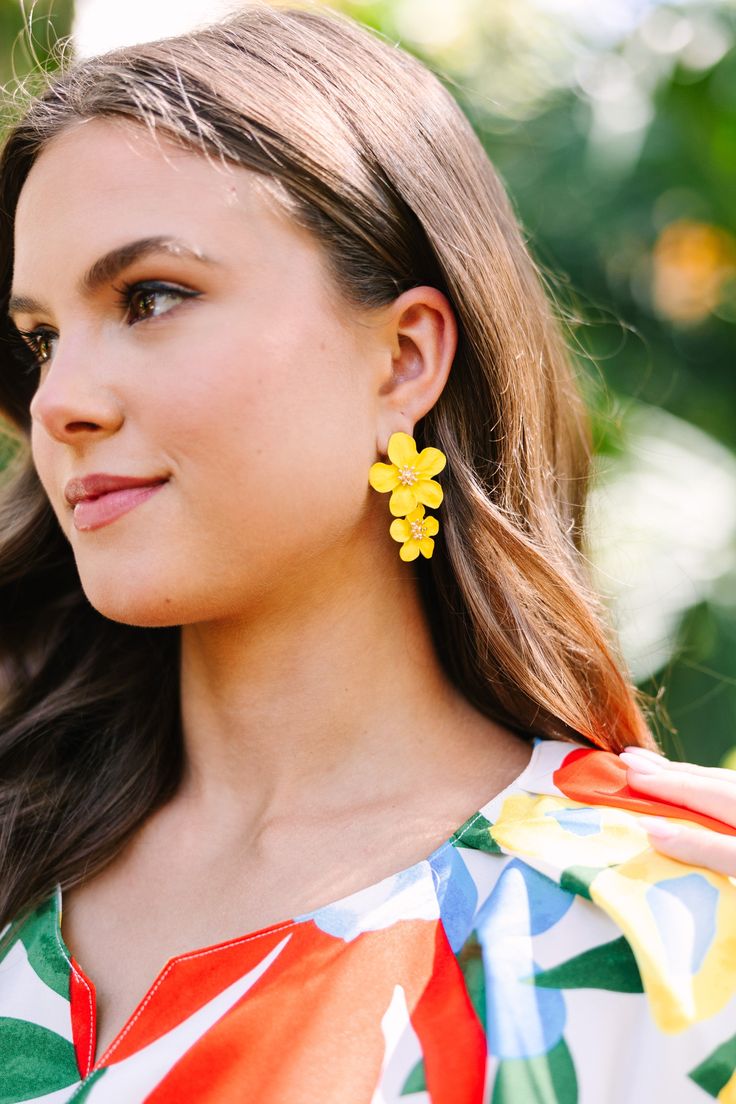 These vibrant flower earrings are so cute! We love the pop of color for spring! These beauties are going to look so good with light little sundresses this season! Chic Summer Jewelry With Flower Charm, Summer Jewelry With 3d Flower Shapes, Spring Party Earrings With 3d Flowers, Summer Party 3d Flower Earrings, Spring Jewelry With 3d Flowers, Playful Summer Drop Earrings, Beach Jewelry Spring Drop Earrings, Flower-shaped Jewelry With Matching Earrings For Spring, Spring Party Flower Earrings With 3d Flowers