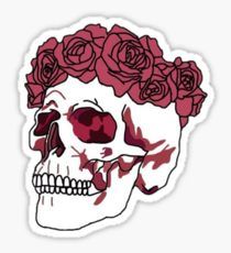 a skull with roses on it's head is shown in red and white colors