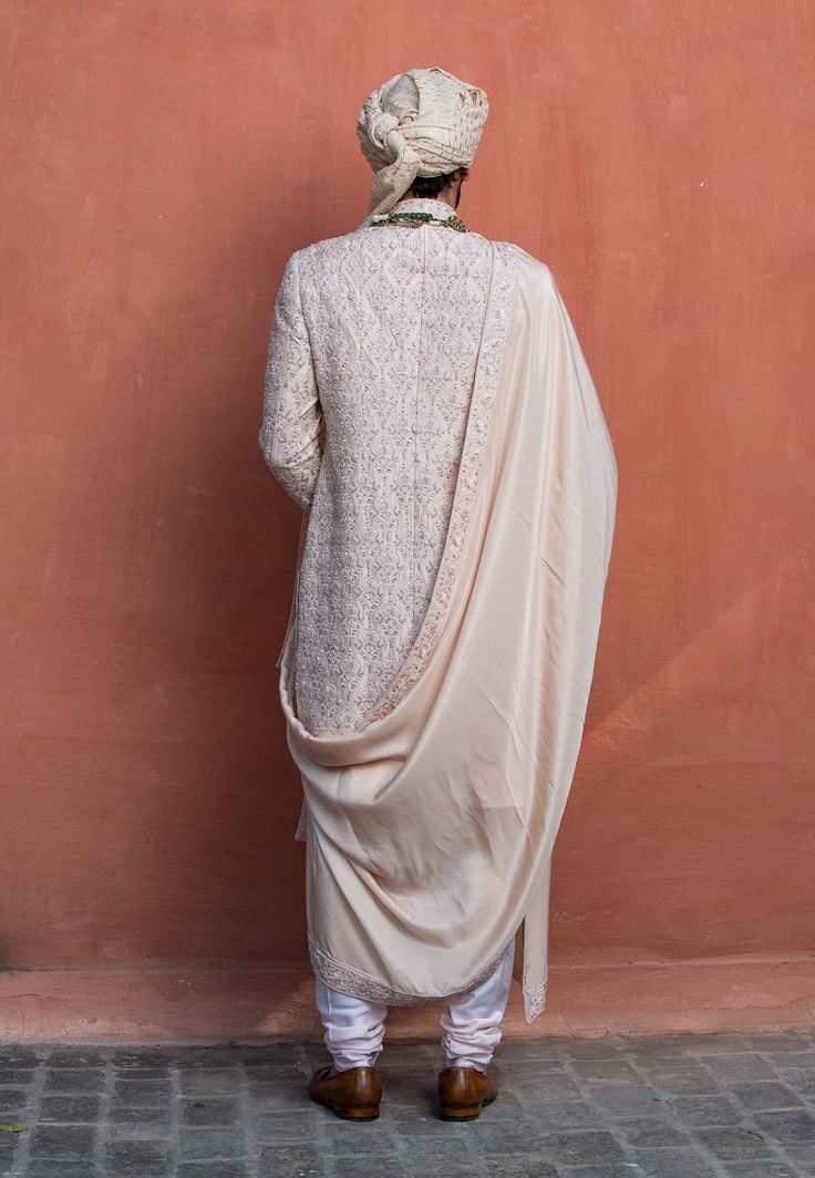 Editor's Note Nude Tafetta Silk Sherwani All Over Embroidered With Tonal Resham Dabka And Beadwork With Taasar Silk Kurta, Churidar And Nude Silk Stole With Four Side Embroidered Border Color: Beige Fabric: Sherwani: Tafetta Silk, Kurta And Churidar: Monga Tussar, Stole: Habutai Silk Component: Sherwani, Kurta, Trouser And Stole Care: Dry Clean Only About the Designer Nitika Gujral’s journey with designing clothes started almost four decades back while she was still in high school and held her f Stole For Men, Silk Stoles, Silk Kurta, Embroidered Border, Beaded Neckline, Border Pattern, Embroidered Fabric, Churidar, Embroidered Silk