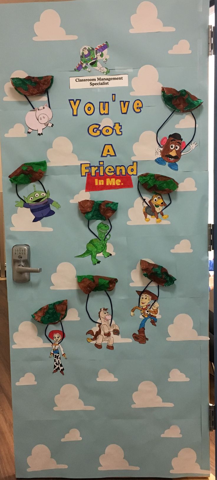 the door is decorated with cartoon characters and saying you've got a friend in me