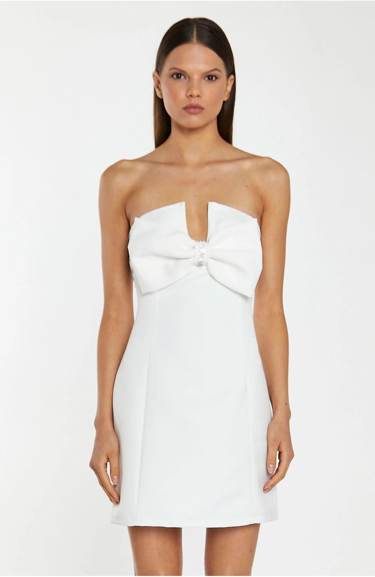 Glamorous Women's Off-White Satin Strapless Bow Mini-Dress. This Off-White Strapless Mini Dress is the ultimate showstopper! Its statement bow design, tailored fit, and mini length are sure to turn heads. Its sparkling diamante trim details finishes off the look perfectly! FEATURES Statement Bow Design Strapless Tailored Fit Mini Length Diamante Trim Details Fully lined Concealed Zip Fastening at the Back Composition: Shell 100% Polyester, Lining 100% Polyester Model Wears Size 10. Model Height: Formal Strapless Mini Dress With Bow Tie Back, Formal Strapless Mini Dress With Bow, Elegant Strapless Mini Dress With Satin Bow, White Strapless Mini Dress With Bow, White Dresses With Detachable Bow, Elegant Mini Dress With Bow Tie For Formal Occasions, Elegant Bow Tie Mini Dress For Formal Occasions, Elegant Formal Mini Dress With Bow Tie, White Bow Tie Back Mini Dress