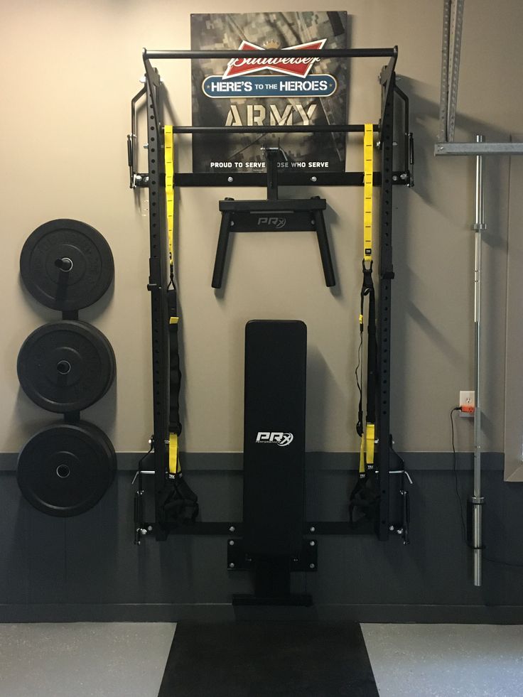 the gym equipment is neatly organized and ready to be used by someone in their home