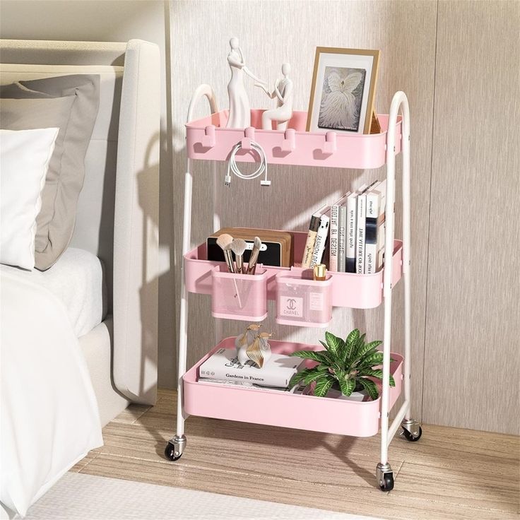 a pink shelf with various items on it