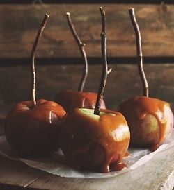 three apples sitting on top of a piece of paper