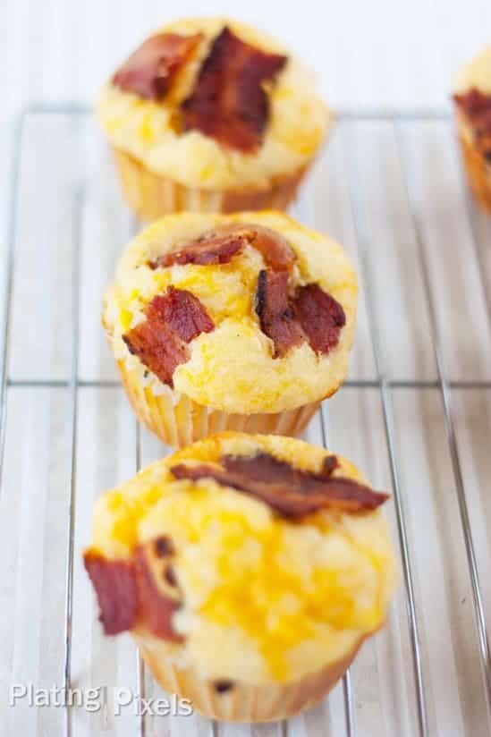 bacon and cheese muffins cooling on a wire rack