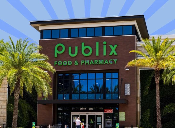 a publix store with palm trees in front