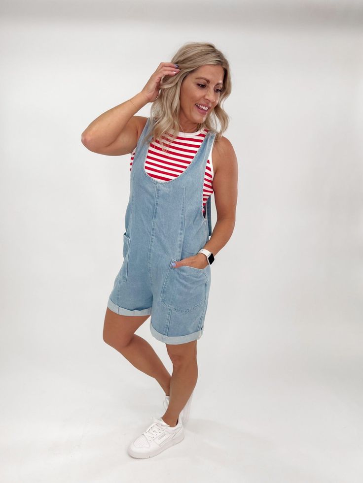 Cove Denim Romper, Med Wash Sleeveless Cotton Shortalls, Casual Style, Casual Cotton Sleeveless Shortalls, Denim Blue Cotton Jumpsuit For Day Out, Medium Wash Cotton Denim Jumpsuit For Day Out, Spring Medium Wash Overalls With Adjustable Straps, Casual Shortalls Overalls For Day Out, Trendy Relaxed Fit Overalls For Day Out, Casual Shortalls With Side Pockets, Relaxed Fit Cotton Shortalls For Day Out