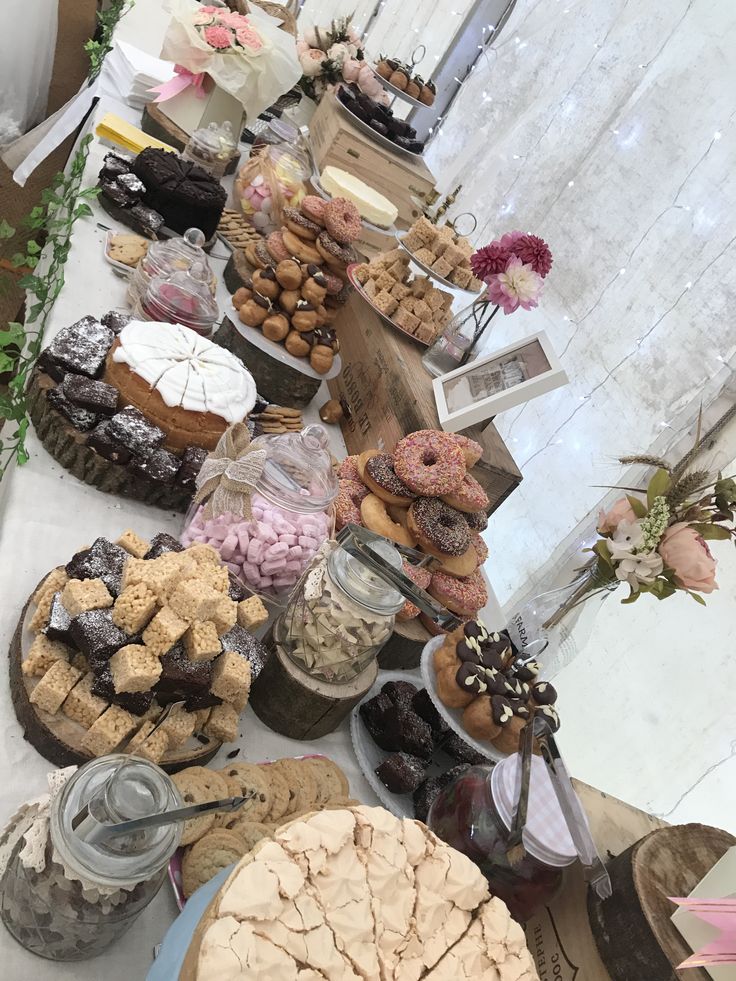 a table filled with lots of desserts and pastries