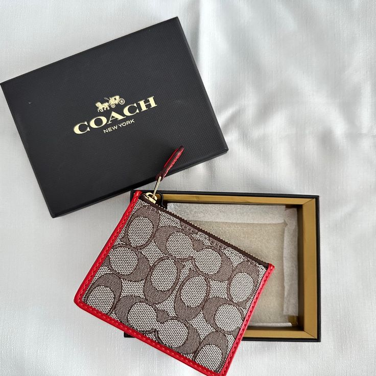 Never Used, Box And Labeled Color: Cocoa And Sport Red Coach Red Bifold Wallet, Rectangular Coin Purse With Original Box As Gift, Compact Coach Wallet As Gift, Classic Coach Coin Purse Gift, Classic Coach Coin Purse As Gift, Coach Rectangular Wallets As Gift, Chic Rectangular Wallets For Gifts, Red Coach Wallet With Interior Card Slots, Red Coach Wallets With Interior Card Slots