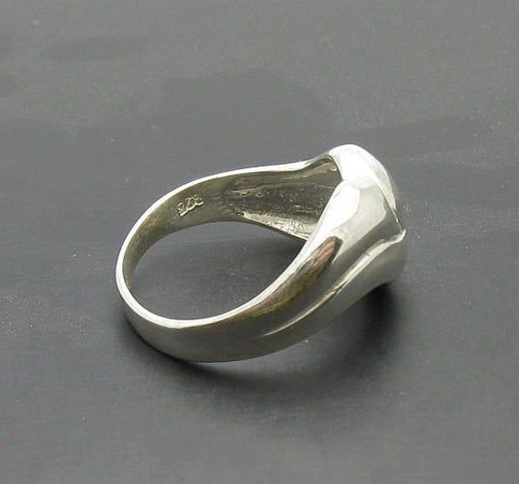 Stylish sterling silver ring 925/1000. Stamped 925.Approximate weight 4.2 grams. Top width 1.2cm. All our jewels are made from solid sterling silver 925/1000 and are carefully crafted by hand in our family workshop. We dispatch your orders in 5 working days, worldwide and the postage is $5. We ship registered priority mail. Please allow 5-7 working days for delivery in Europe and 10-15 working days outside Europe. For any questions - please do not hesitate to contact me! Sterling Silver Hallmarked Dome Ring, Sterling Silver Rings With Shiny Finish, Silver Hallmarked Dome Ring, Sterling Silver Signet Ring With 925 Stamp, Sterling Silver Concave Ring Stamped 925, Silver Polished Sterling Silver Heart Ring, Classic Silver Heart Ring With Polished Finish, Silver Sterling Heart Ring With Polished Finish, Sterling Silver Concave Rings Hallmarked