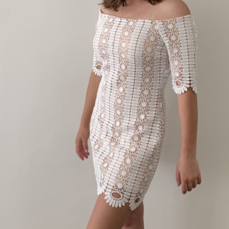 Flirty And Romantic, This White Floral Pattern Crochet Lace Dress Has A Hollowed Out Design Over A Nude Color Lining. Fitted Bodice With Rubber Trim To Keep It In Place. Bodycon-Style Throughout With A Tiny Bit Of Stretch For Comfort. Pretty Scalloped Hem, Attractive Half Sleeves And Exposed Rear Zipper. Wear This Elegant Dress To Any Formal Or Semi-Formal Occasions Like Bridal, Cocktail Parties, Ceremonies, Banquets, Festivals, Graduations, Etc. Hand Wash; Low Iron (100% Polyester Shell & Linin Fitted Crochet Dress With Lace Trim For Day Out, Elegant Off-shoulder White Lace Dress, Mini Lace Crochet Dress For Brunch, Lace Crochet Mini Dress For Brunch, Fitted Summer Crochet Dress For Brunch, Fitted Spring Lace Dress With Crochet Trim, Spring Fitted Lace Dress With Crochet Trim, White Crochet Dress For Day Out, Fitted Lace Crochet Dress For Summer