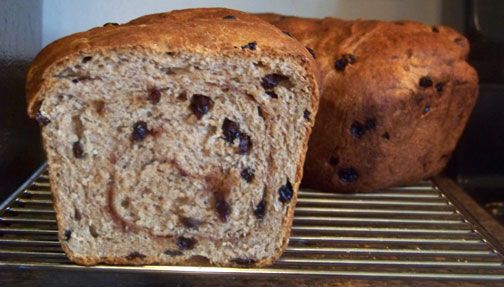 two loaves of bread sitting on top of a rack