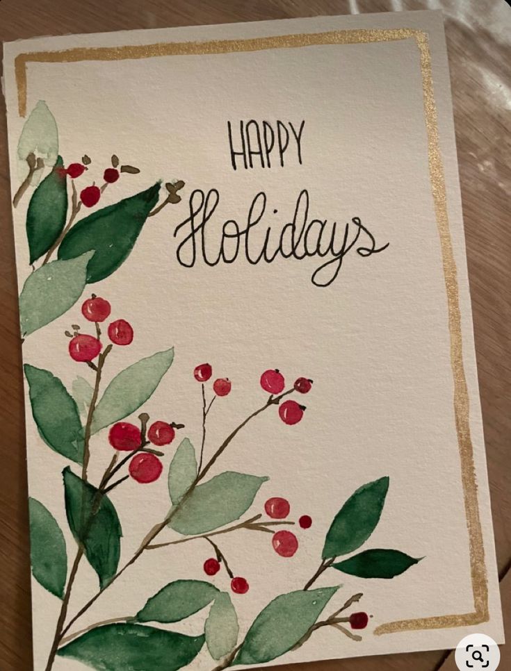 a card with watercolor leaves and berries on it that says happy holidays in gold lettering