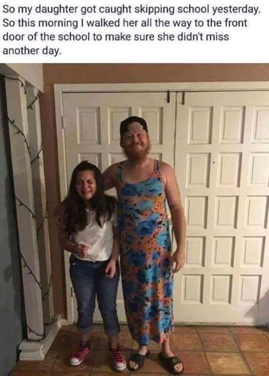 two women standing next to each other in front of a garage door